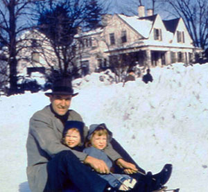 Photo of Demi with her sister and father in front of their old New England farmhouse